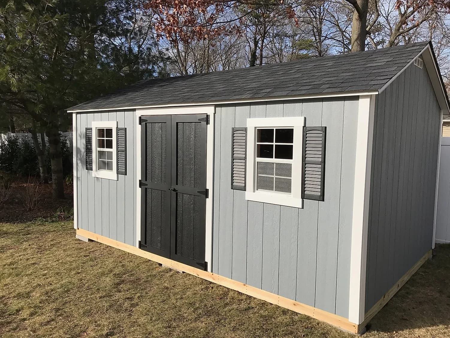 Gray CNY Sheds shed built on-site with double doors and windows