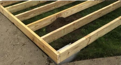 Treated timber floor framing during a shed build