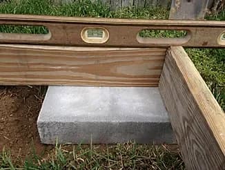 Cement-block base supporting a CNY Sheds build